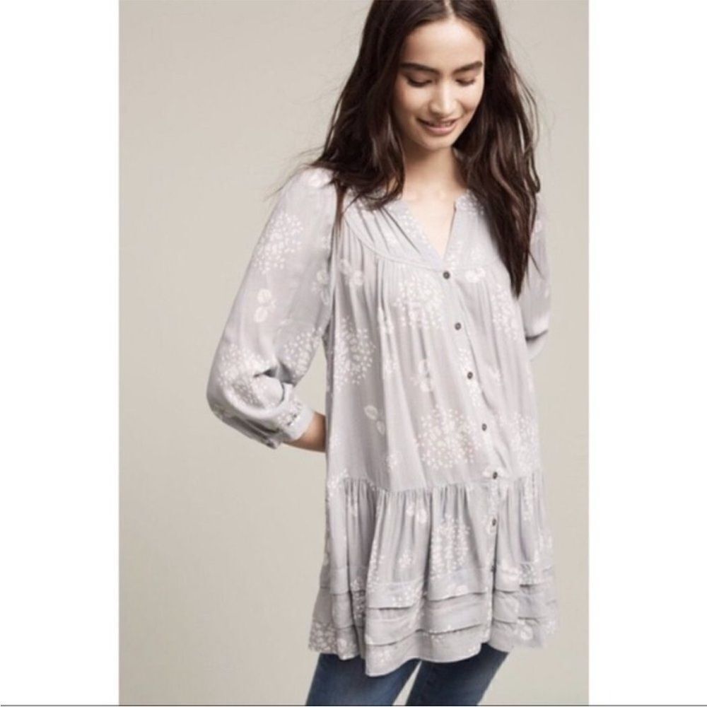 Anthropologie holding Horses floral tunic top
